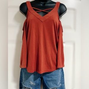 Women’s cold shoulder burnt orange top with cross cross front.  Size S